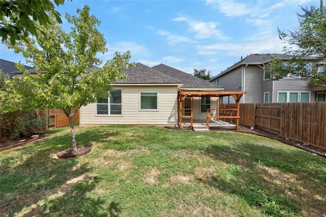 a backyard of a house with seating space