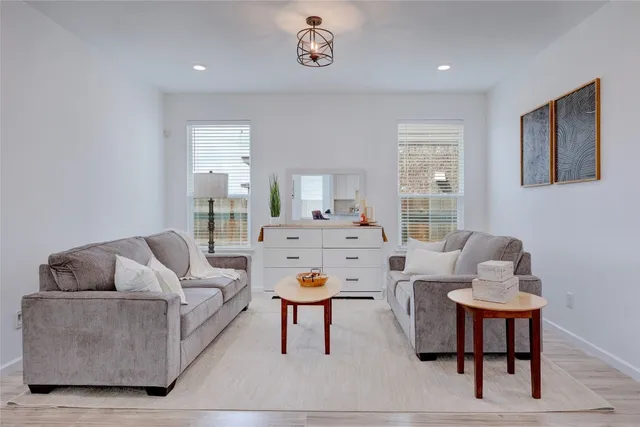 a living room with furniture and a window
