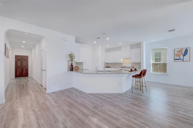 a view of kitchen with wooden floor