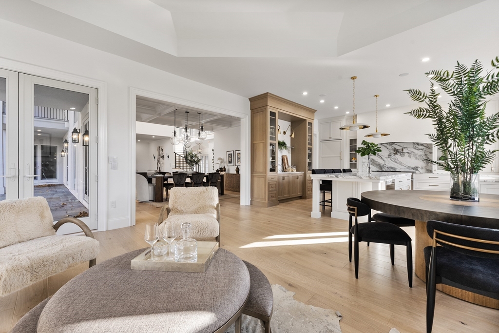 335 Heath Street Brookline, MA 02467 - Photo 12 of 38 a living room with furniture kitchen view and a table