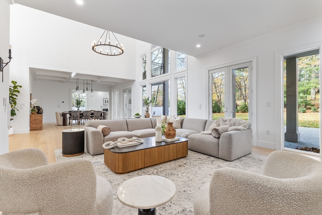 335 Heath Street Brookline, MA 02467 - Photo 14 of 38 a living room with furniture and a large window