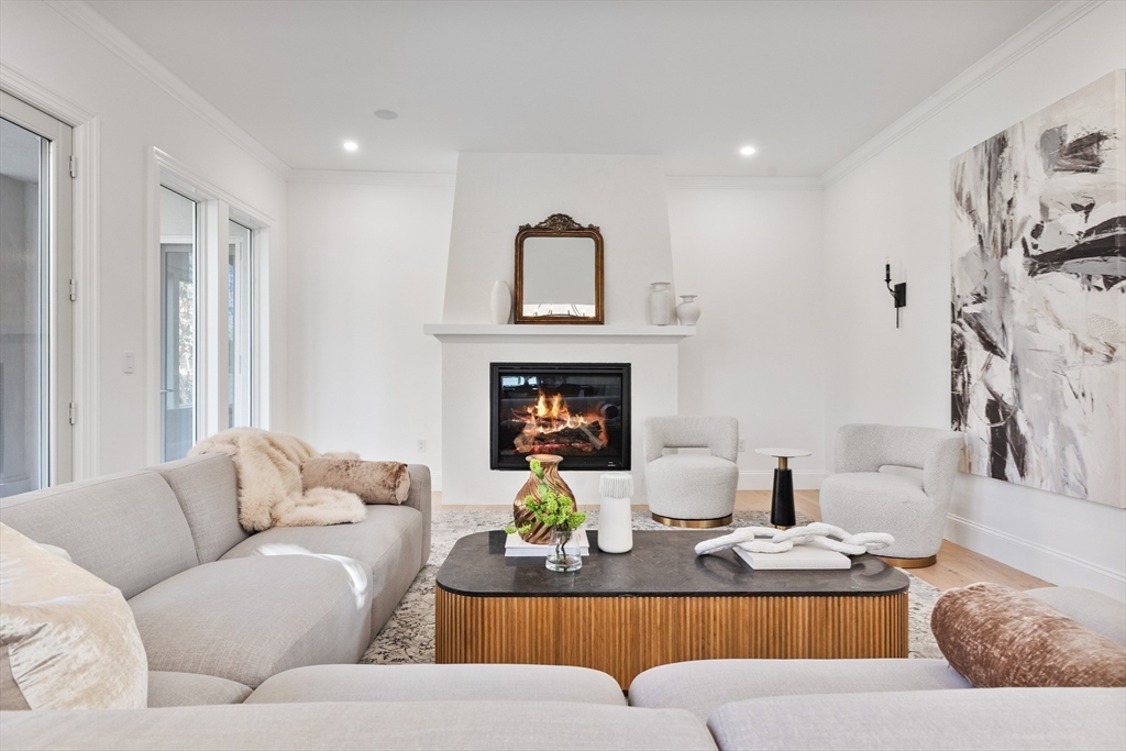 335 Heath Street Brookline, MA 02467 - Photo 15 of 38 a living room with furniture fireplace and window