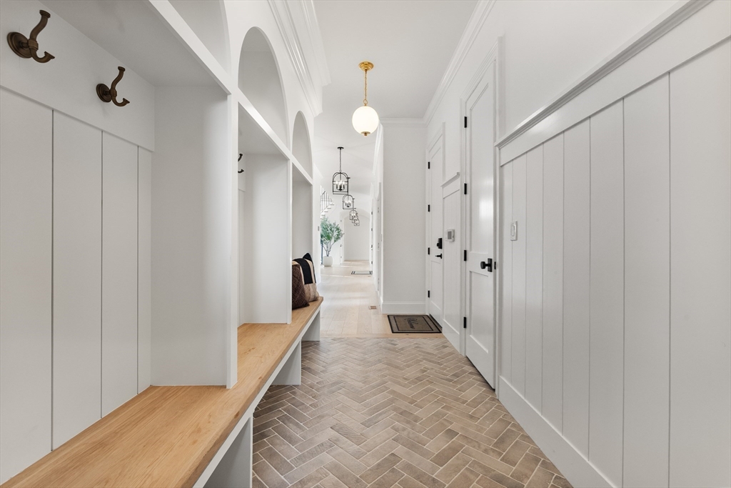 335 Heath Street Brookline, MA 02467 - Photo 17 of 38 a view of a hallway with wooden floor and staircase