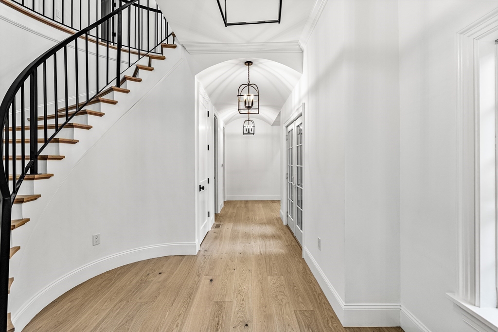 335 Heath Street Brookline, MA 02467 - Photo 20 of 38 a view of a hallway view with wooden floor and staircase