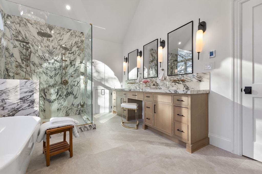 335 Heath Street Brookline, MA 02467 - Photo 25 of 38 a bathroom with a sink and a mirror