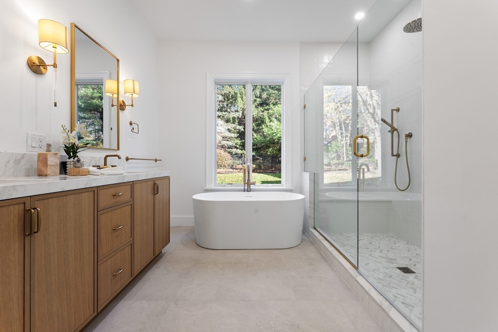 335 Heath Street Brookline, MA 02467 - Photo 30 of 38 a bathroom with a double vanity sink mirror and bathtub