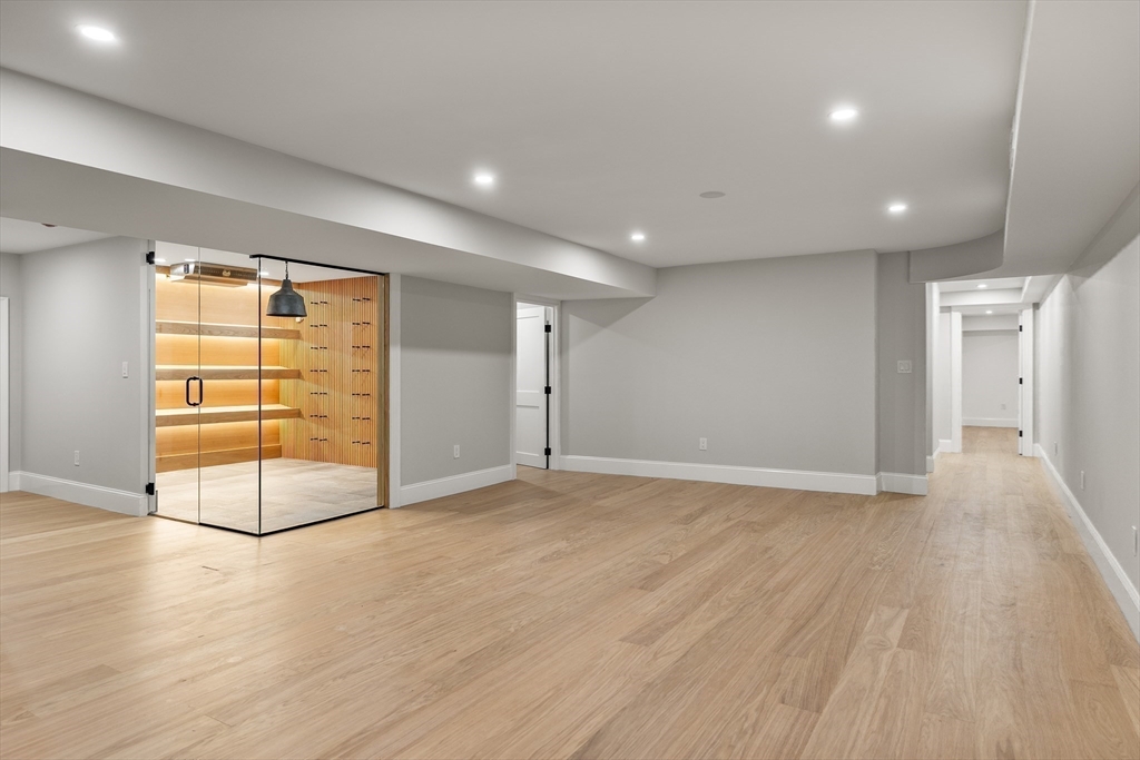 335 Heath Street Brookline, MA 02467 - Photo 31 of 38 an empty room with wooden floor and windows