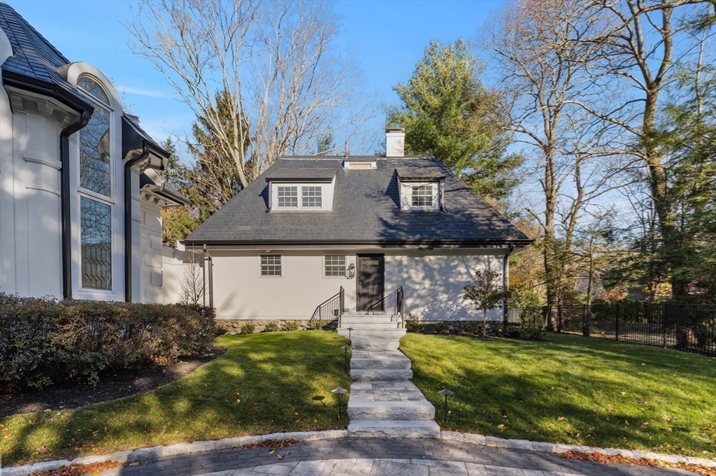 335 Heath Street Brookline, MA 02467 - Photo 34 of 38 a front view of a house with garden