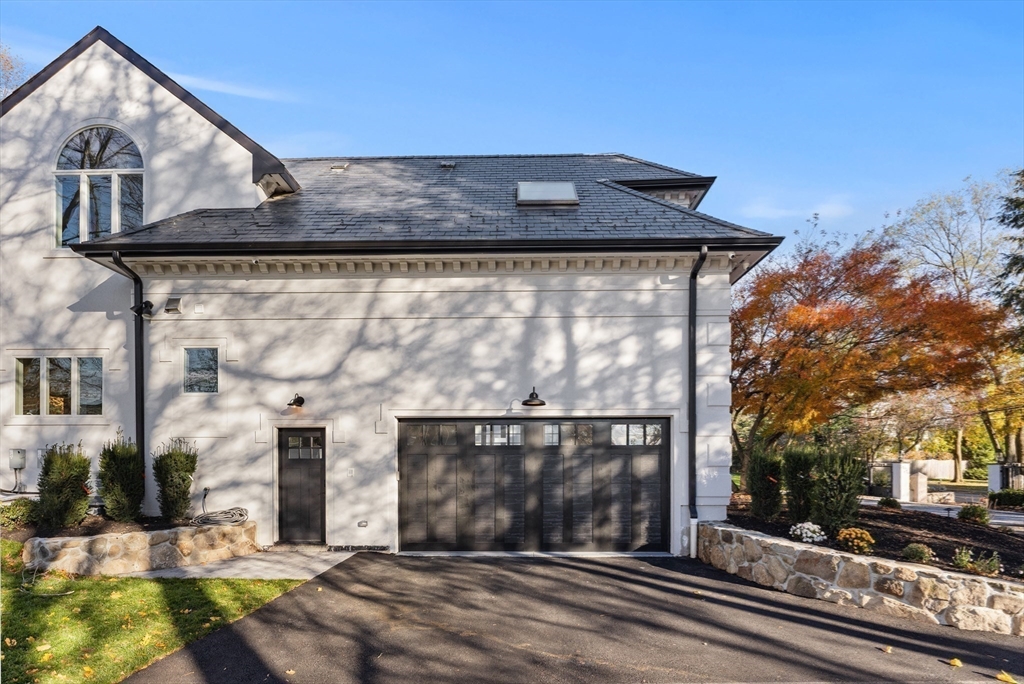 335 Heath Street Brookline, MA 02467 - Photo 35 of 38 a front view of a house with a yard