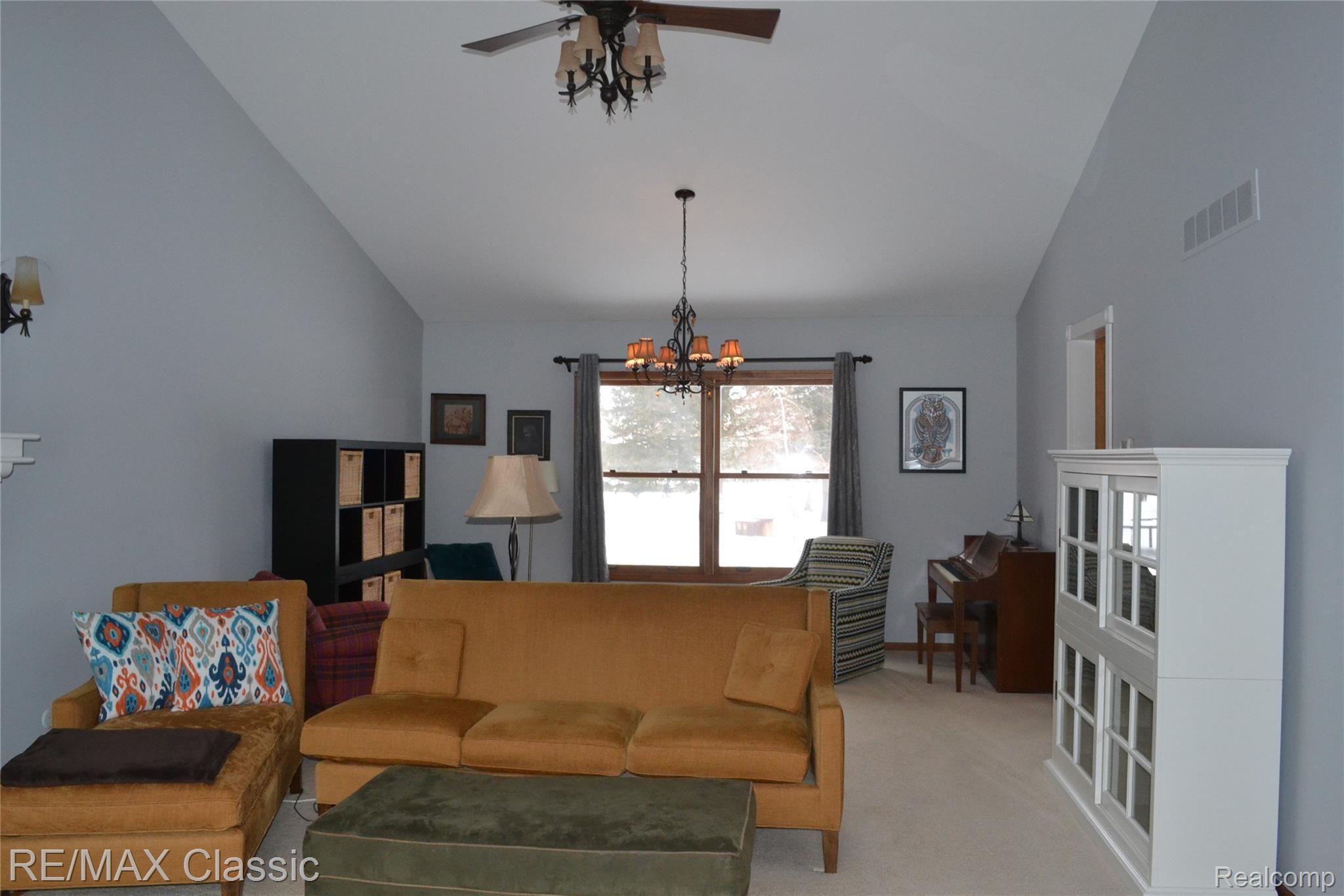 4350 Ravinewood Drive Commerce Township, MI 48382 - Photo 6 of 31 Living Room w/ Fireplace