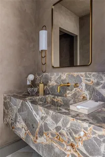 a living room with granite countertop furniture and a fireplace
