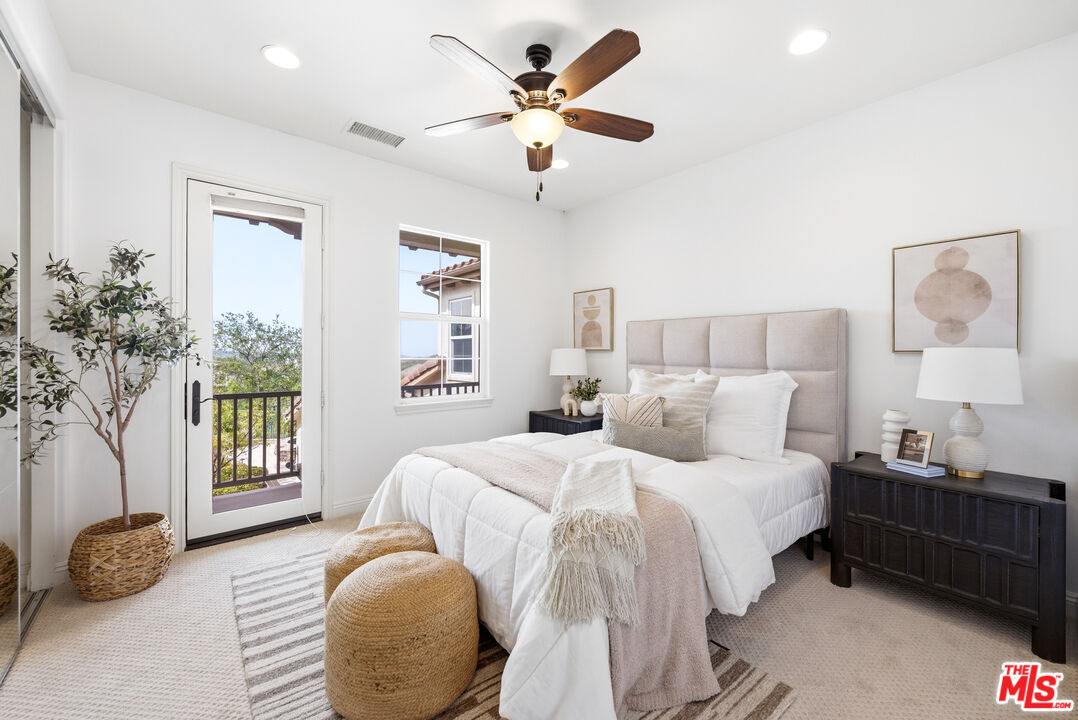 3447 Sentinel Court Simi Valley, CA 93065 - Photo 11 of 19 a bedroom with a bed and a large window