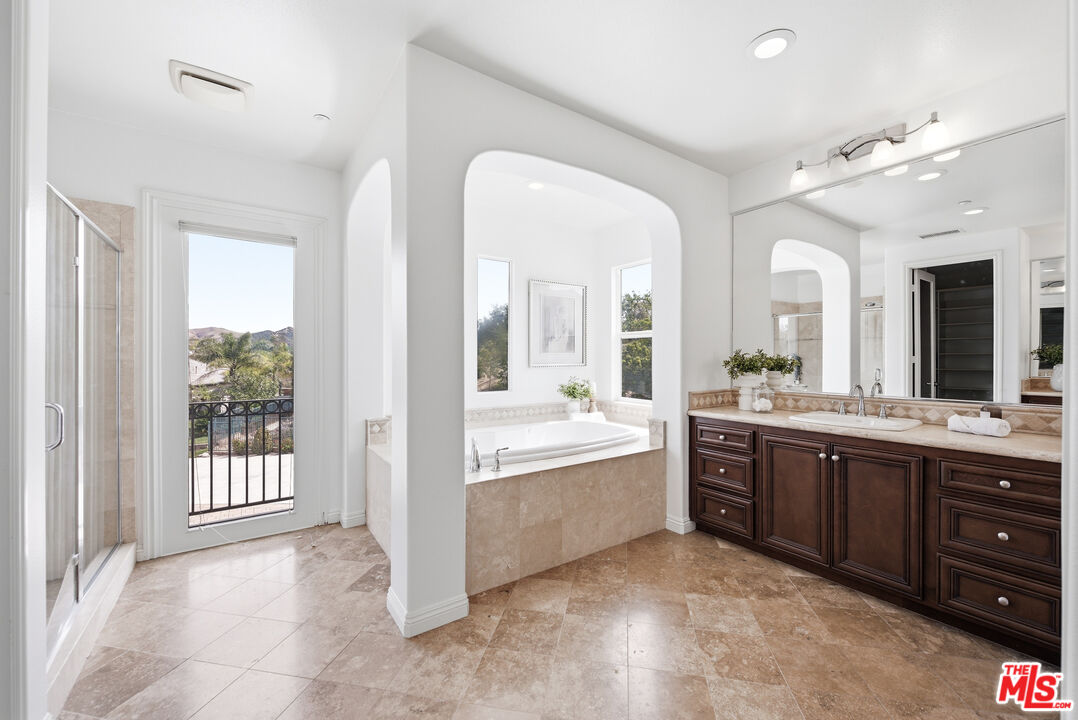 3447 Sentinel Court Simi Valley, CA 93065 - Photo 13 of 19 a large bathroom with a large tub and sink
