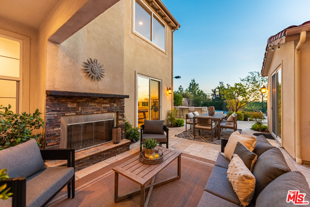 3447 Sentinel Court Simi Valley, CA 93065 - Photo 15 of 19 a living room with furniture fireplace and a large window