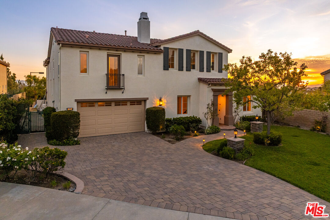 3447 Sentinel Court Simi Valley, CA 93065 - Photo 2 of 19 a front view of a house with garden