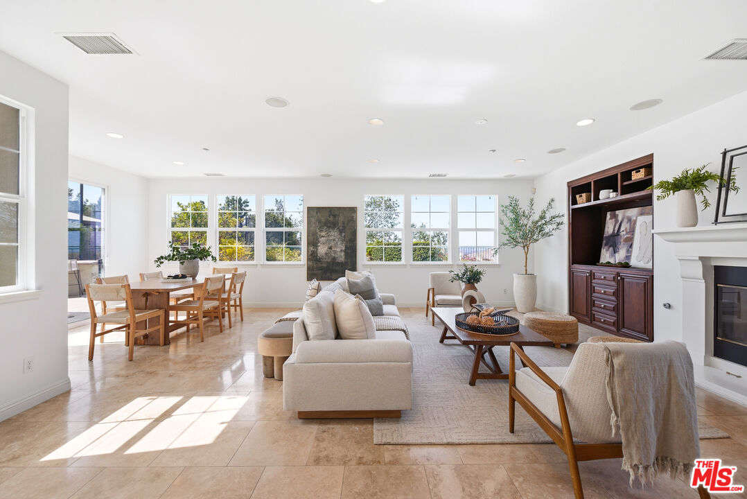3447 Sentinel Court Simi Valley, CA 93065 - Photo 5 of 19 a living room with fireplace furniture and a flat screen tv