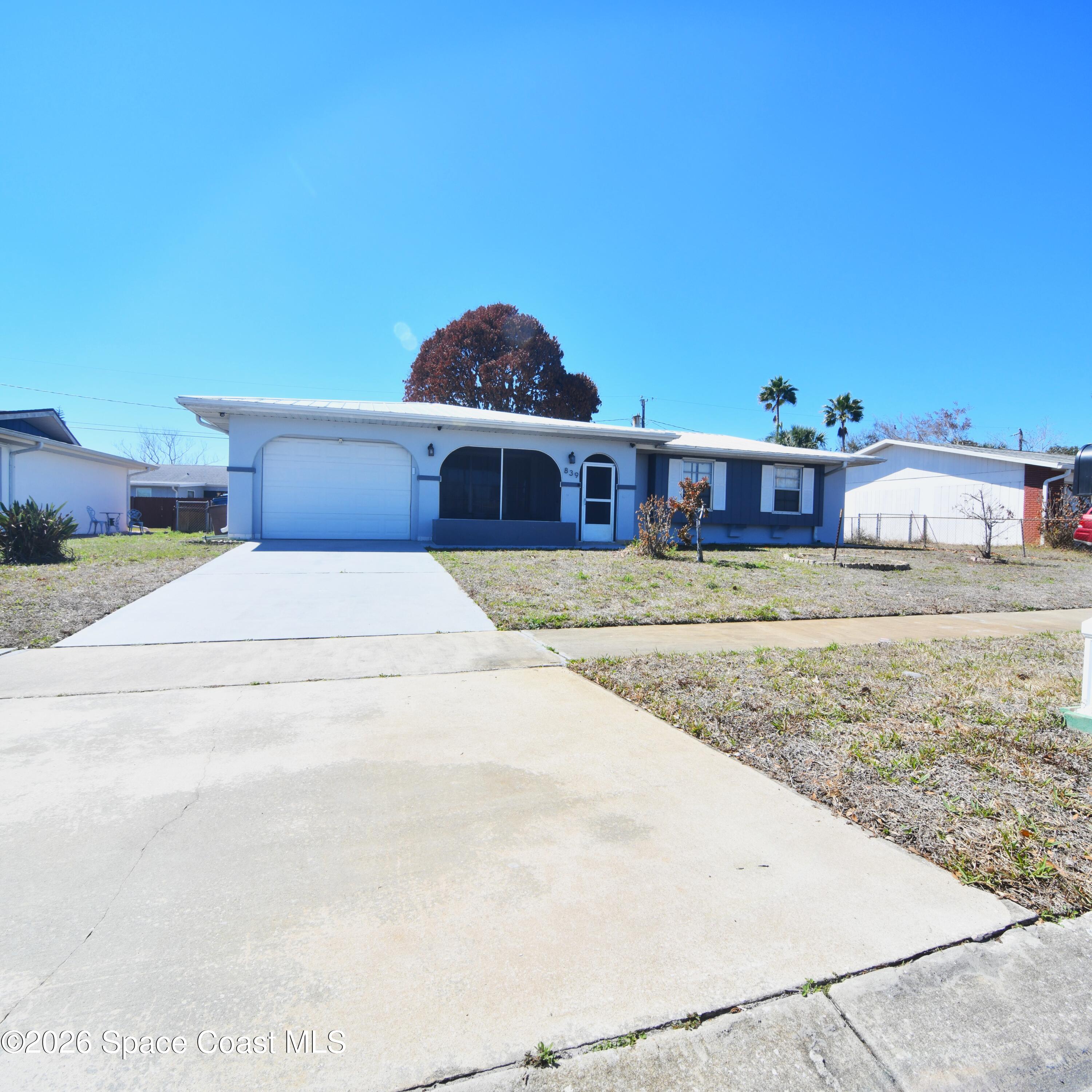 839 Angle Street Northeast Palm Bay, FL 32905 - Photo 2 of 21 a view of a house with big yard