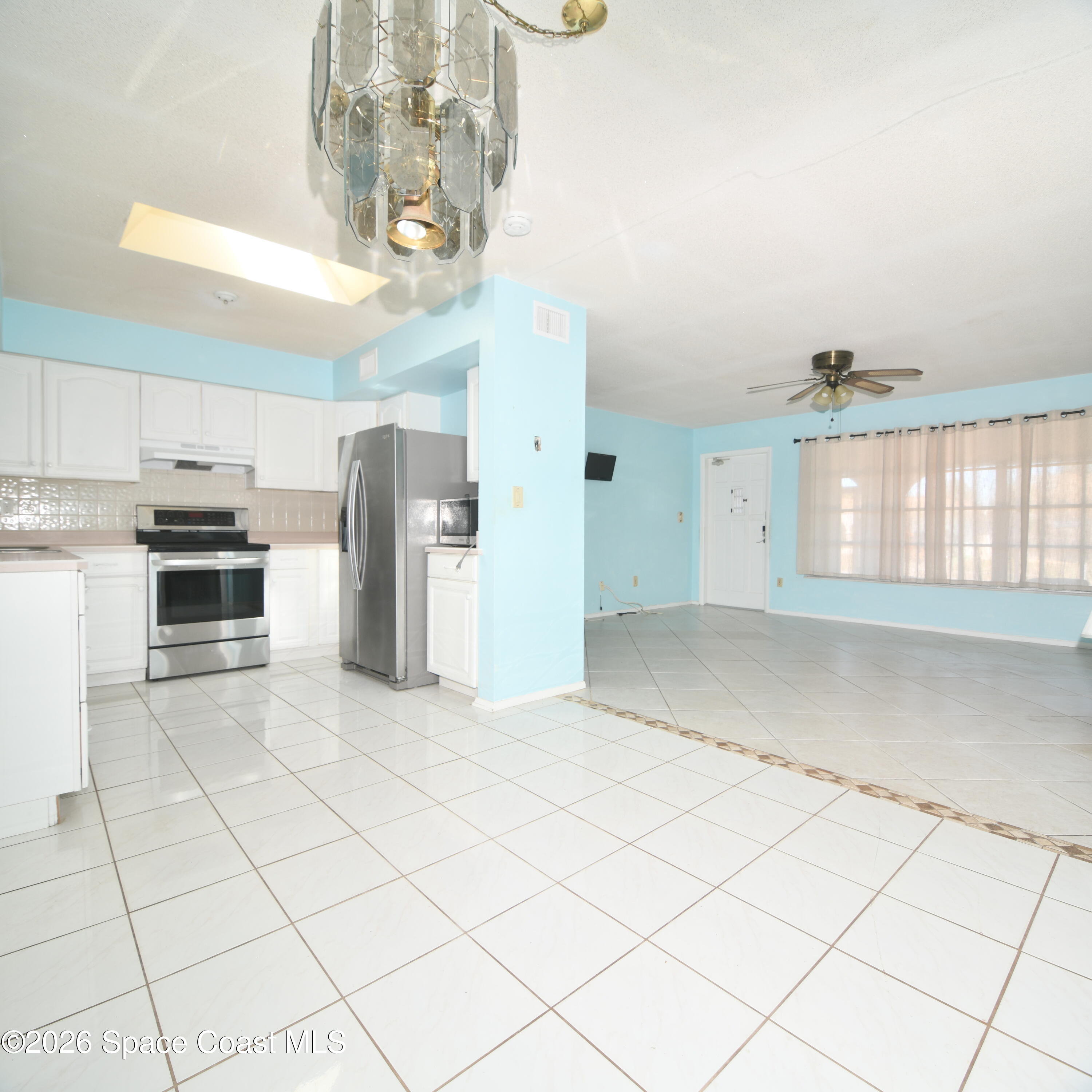 839 Angle Street Northeast Palm Bay, FL 32905 - Photo 6 of 21 a view of a kitchen with a sink and cabinets