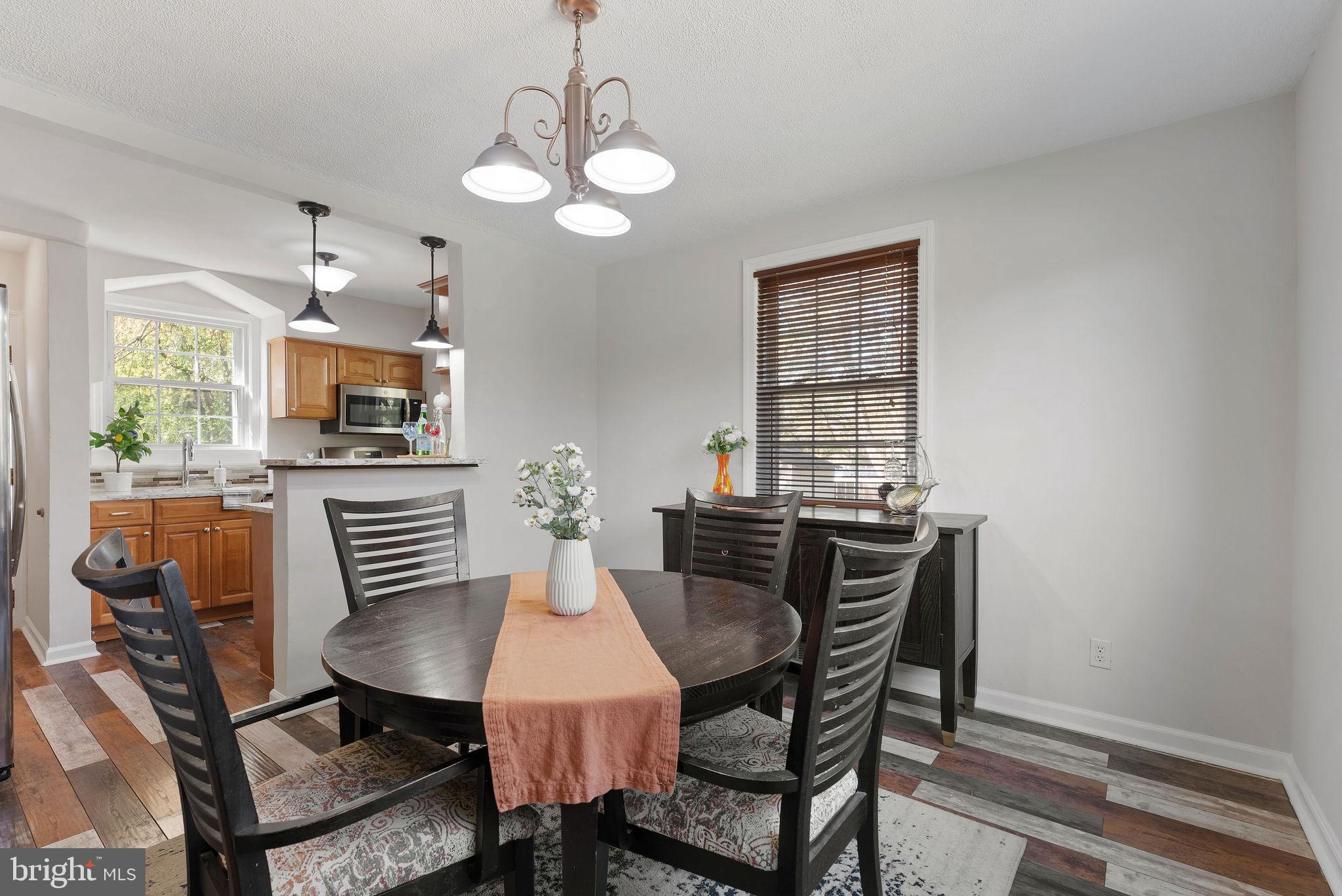 2600 Arcola Avenue Silver Spring, MD 20902 - Photo 13 of 39 a view of a dining room with furniture window and wooden floor