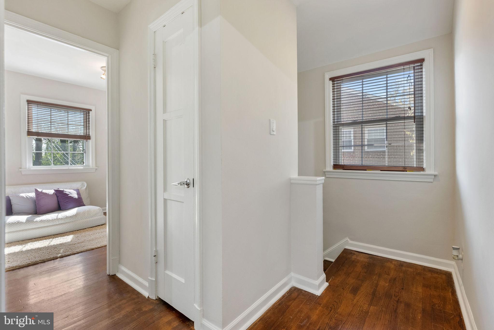 2600 Arcola Avenue Silver Spring, MD 20902 - Photo 24 of 39 a view of an empty room with wooden floor and a window