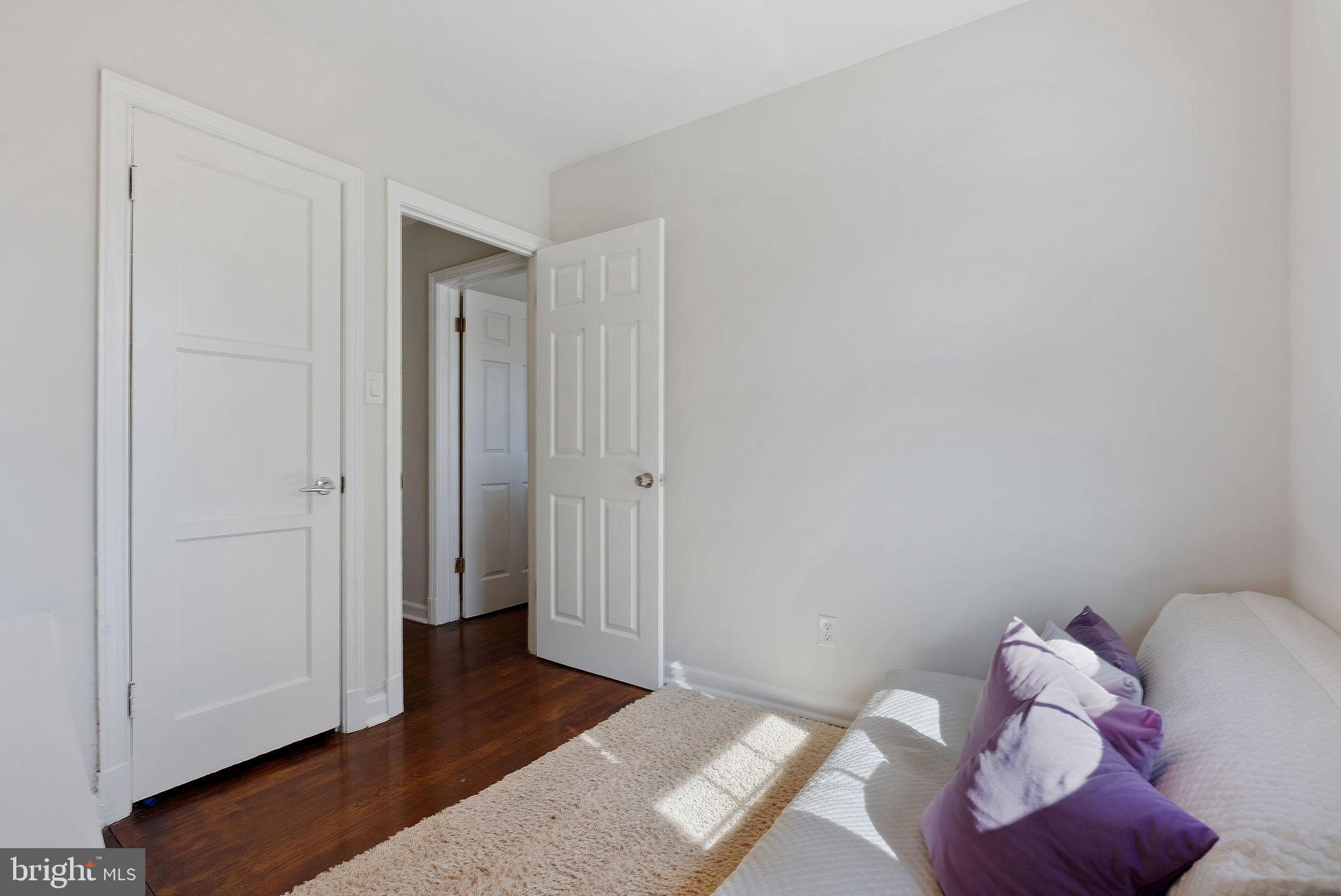 2600 Arcola Avenue Silver Spring, MD 20902 - Photo 33 of 39 a bedroom with a bed and wooden floor