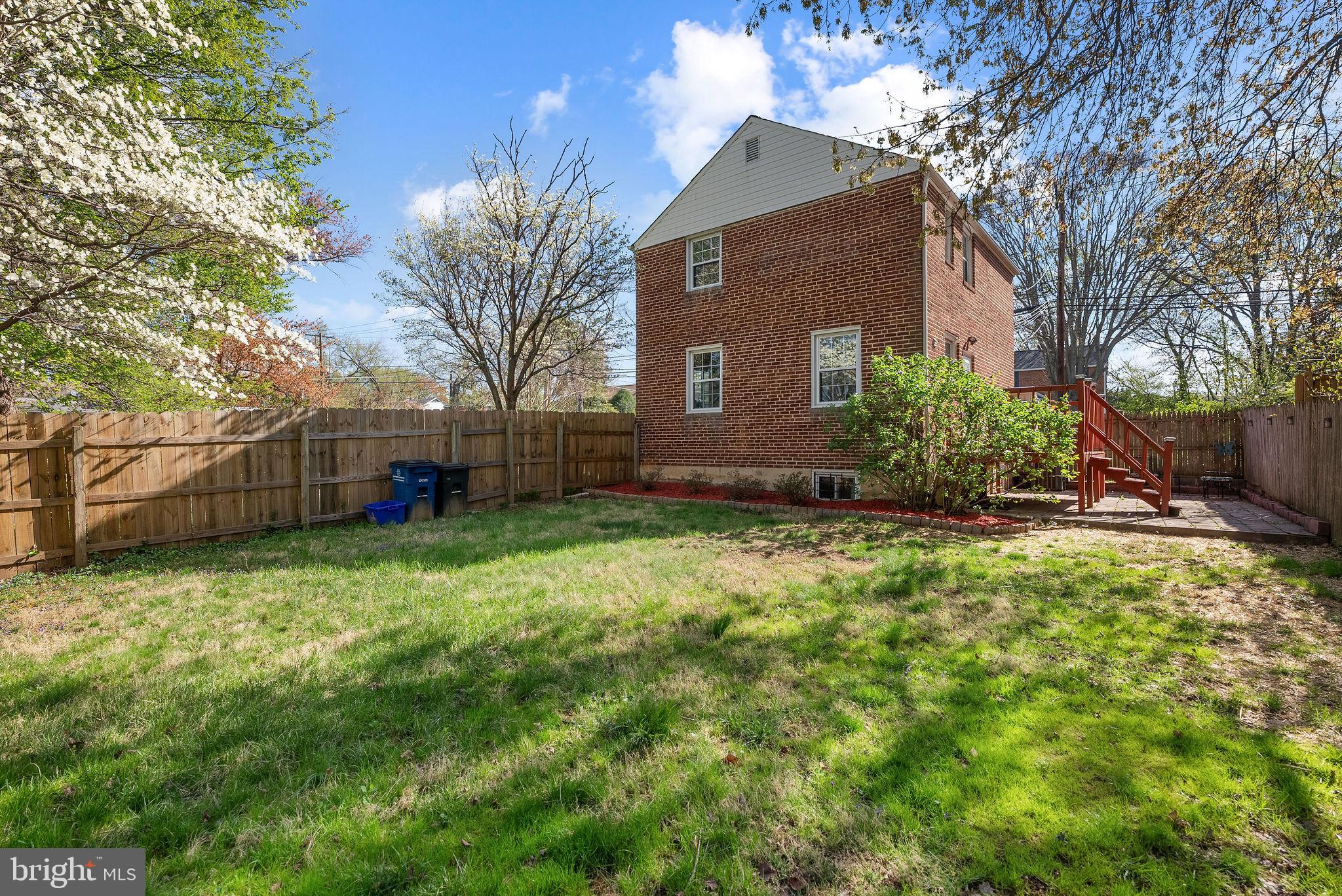 2600 Arcola Avenue Silver Spring, MD 20902 - Photo 39 of 39 a backyard of a house with plants and large tree