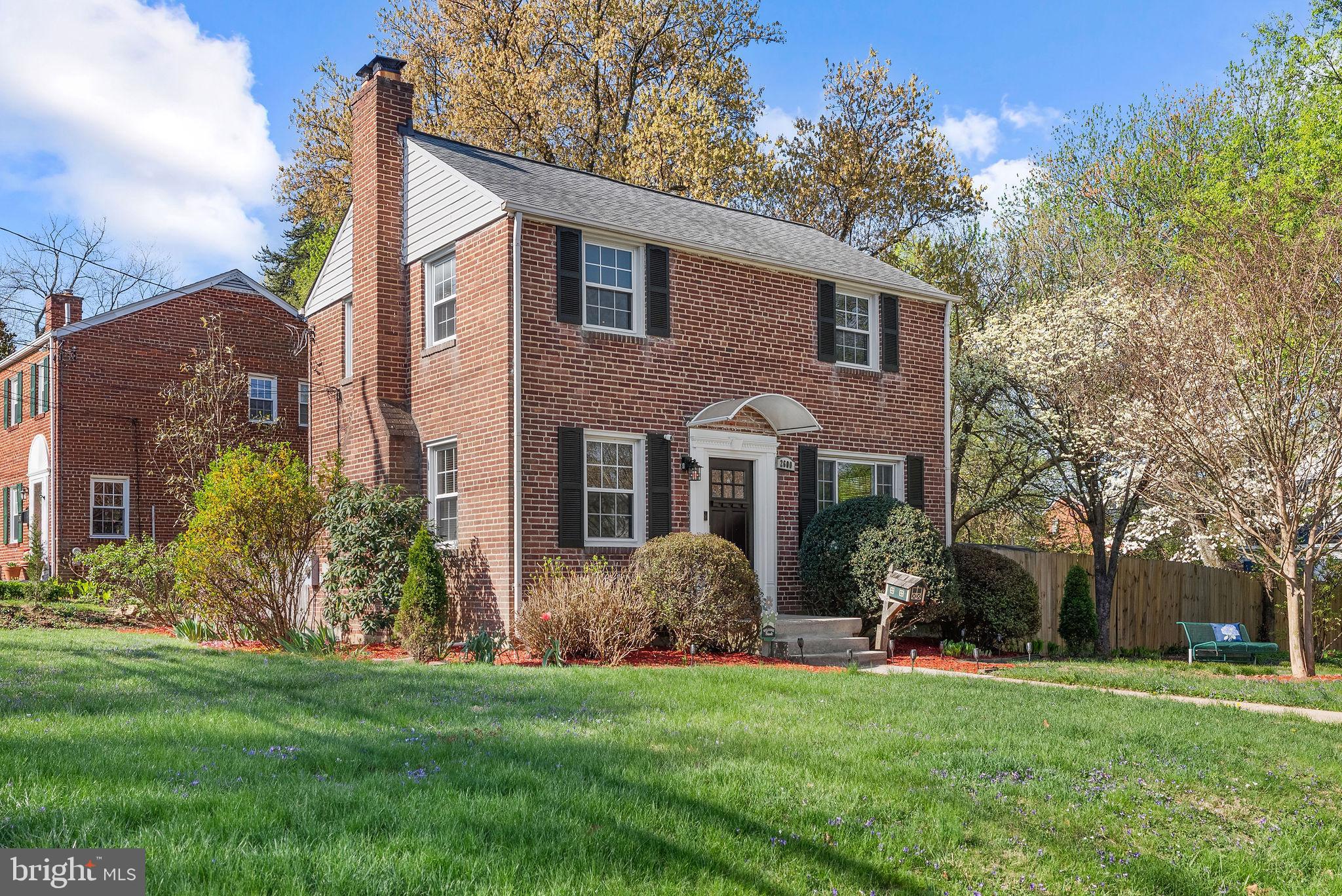 2600 Arcola Avenue Silver Spring, MD 20902 - Photo 4 of 39 a front view of a house with a garden