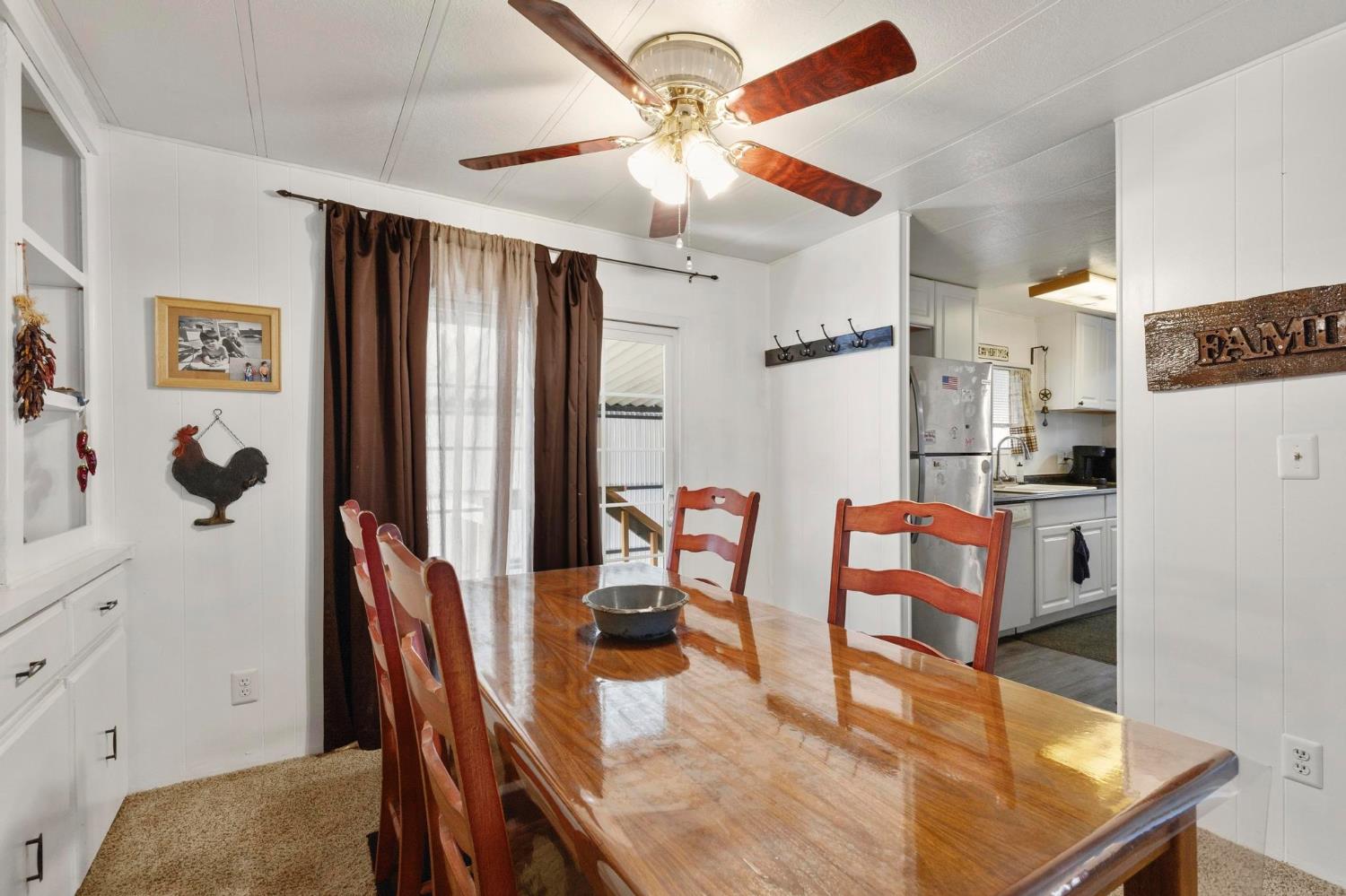 10383 Larkin Road, Unit 15 Live Oak, CA 95953 - Photo 13 of 32 a dining room with furniture and window