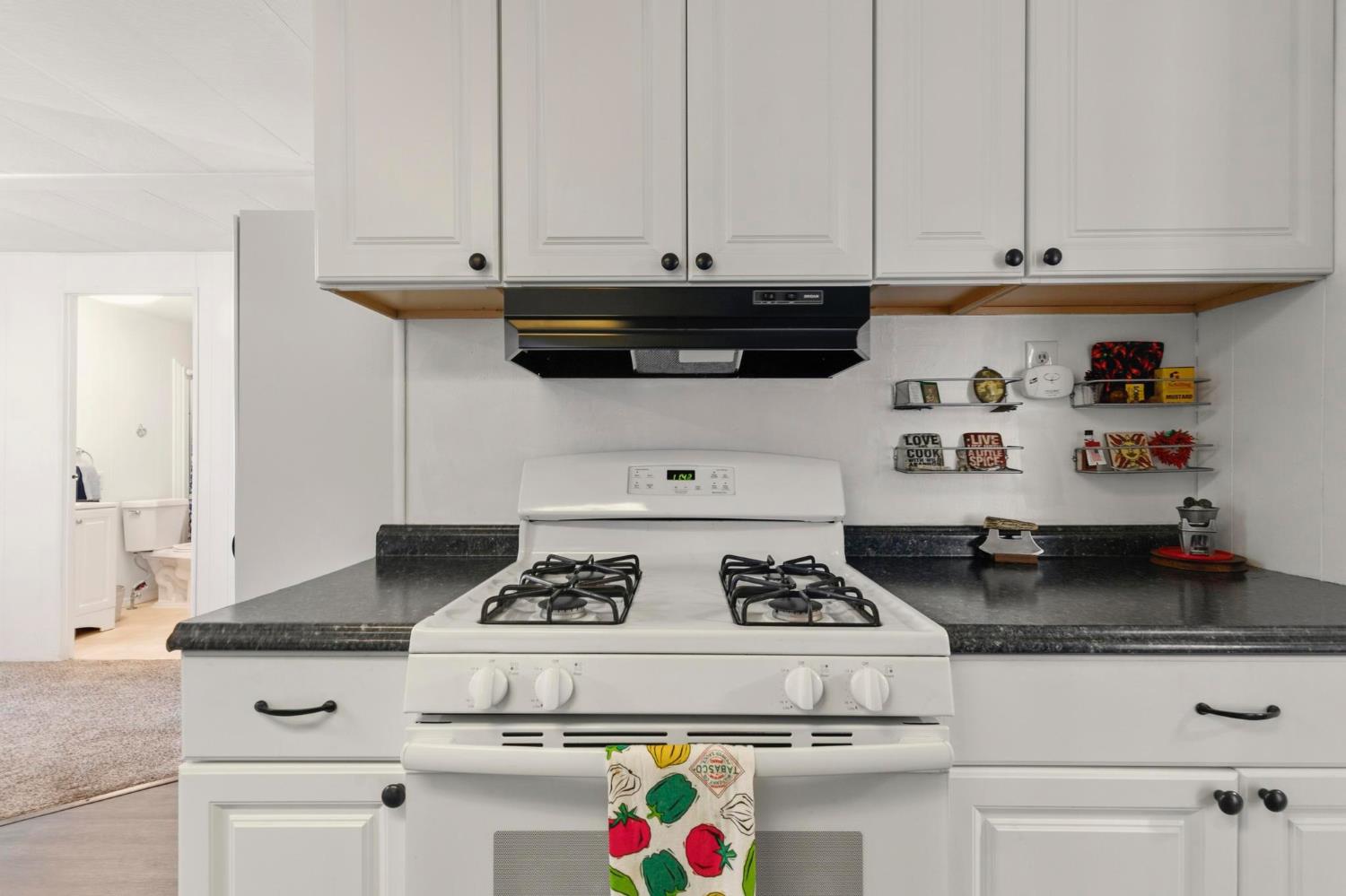 10383 Larkin Road, Unit 15 Live Oak, CA 95953 - Photo 16 of 32 a white stove top oven sitting inside of a kitchen
