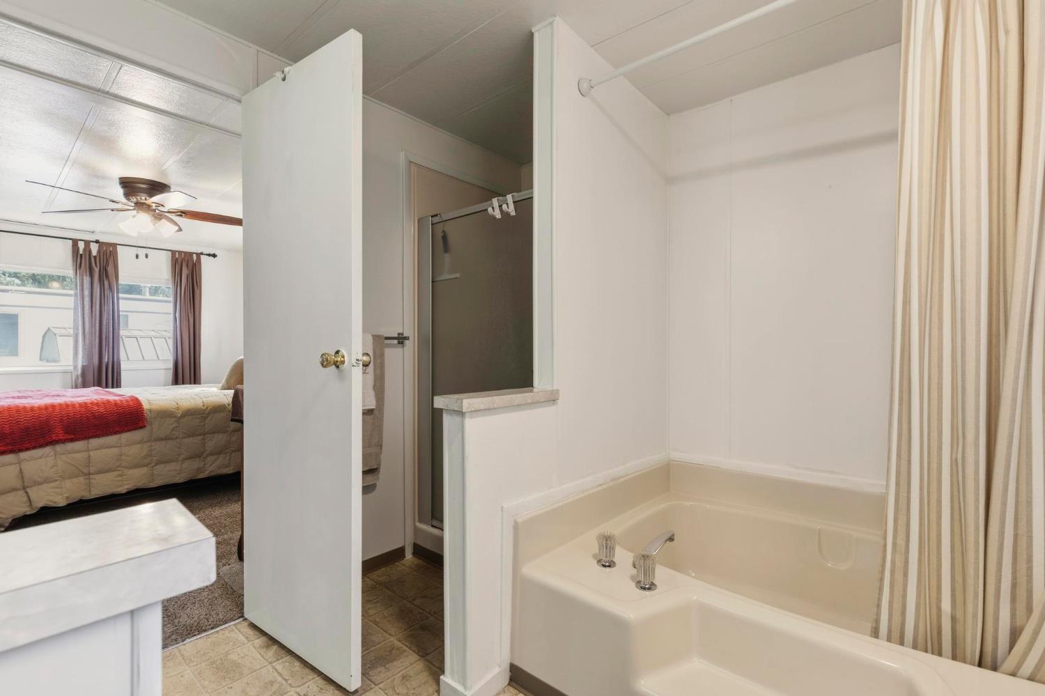 10383 Larkin Road, Unit 15 Live Oak, CA 95953 - Photo 22 of 32 a bathroom with a bathtub and a shower