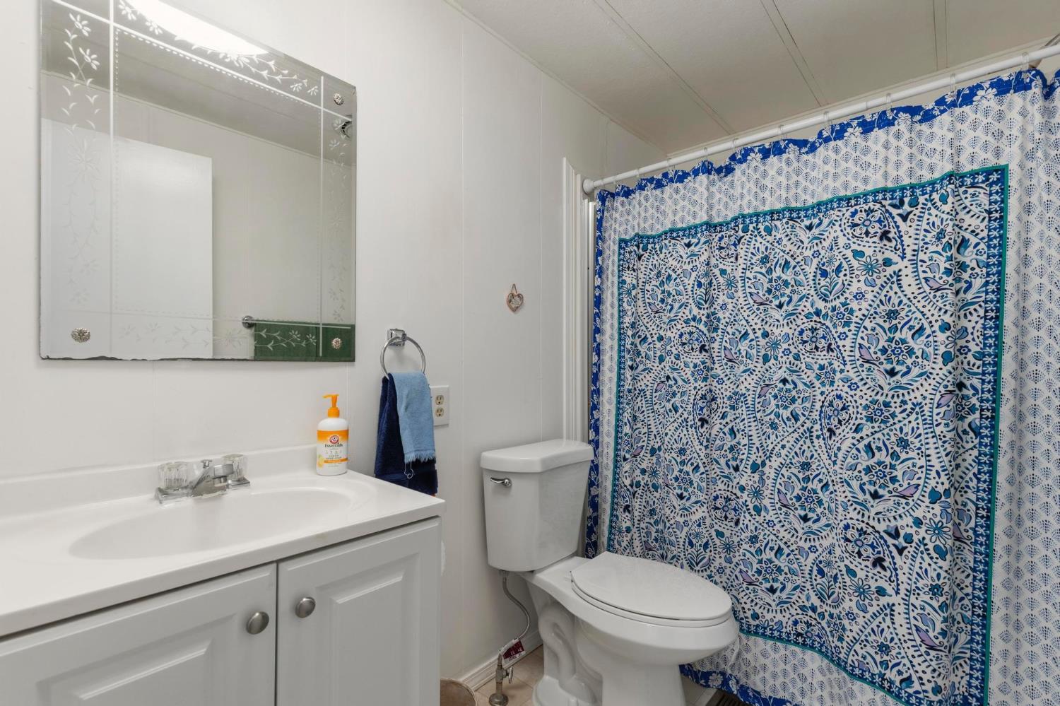 10383 Larkin Road, Unit 15 Live Oak, CA 95953 - Photo 23 of 32 a bathroom with a sink toilet and shower