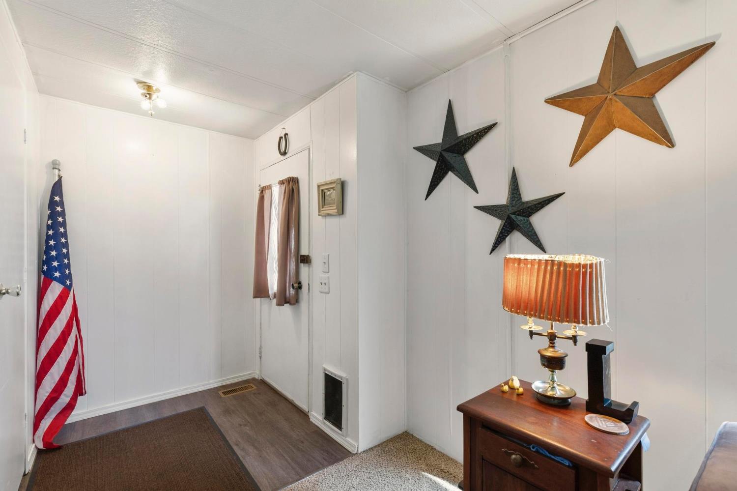 10383 Larkin Road, Unit 15 Live Oak, CA 95953 - Photo 8 of 32 a hallway with a computer on a desk and chair
