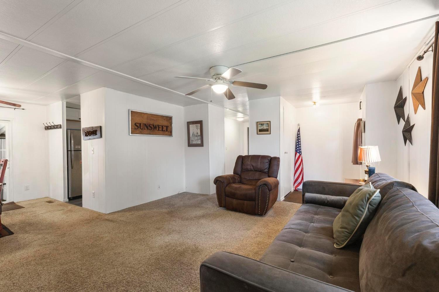 10383 Larkin Road, Unit 15 Live Oak, CA 95953 - Photo 10 of 32 a living room with furniture and a ceiling fan