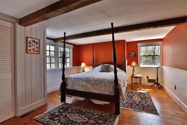 123 East Bare Hill Road Harvard, MA 01451 - Photo 14 of 19 a bedroom with a bed and wooden floor