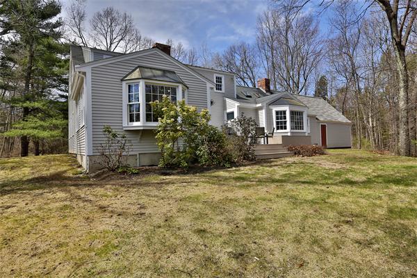 123 East Bare Hill Road Harvard, MA 01451 - Photo 19 of 19 a front view of a house with a garden