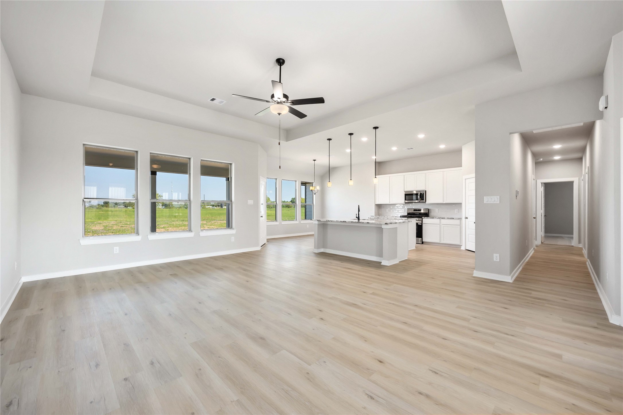 6702 Pelican Lane Beasley, TX 77417 - Photo 6 of 29
This home features a spacious, open-concept layout and an expansive family room connected to a gourmet kitchen and a bright breakfast area.