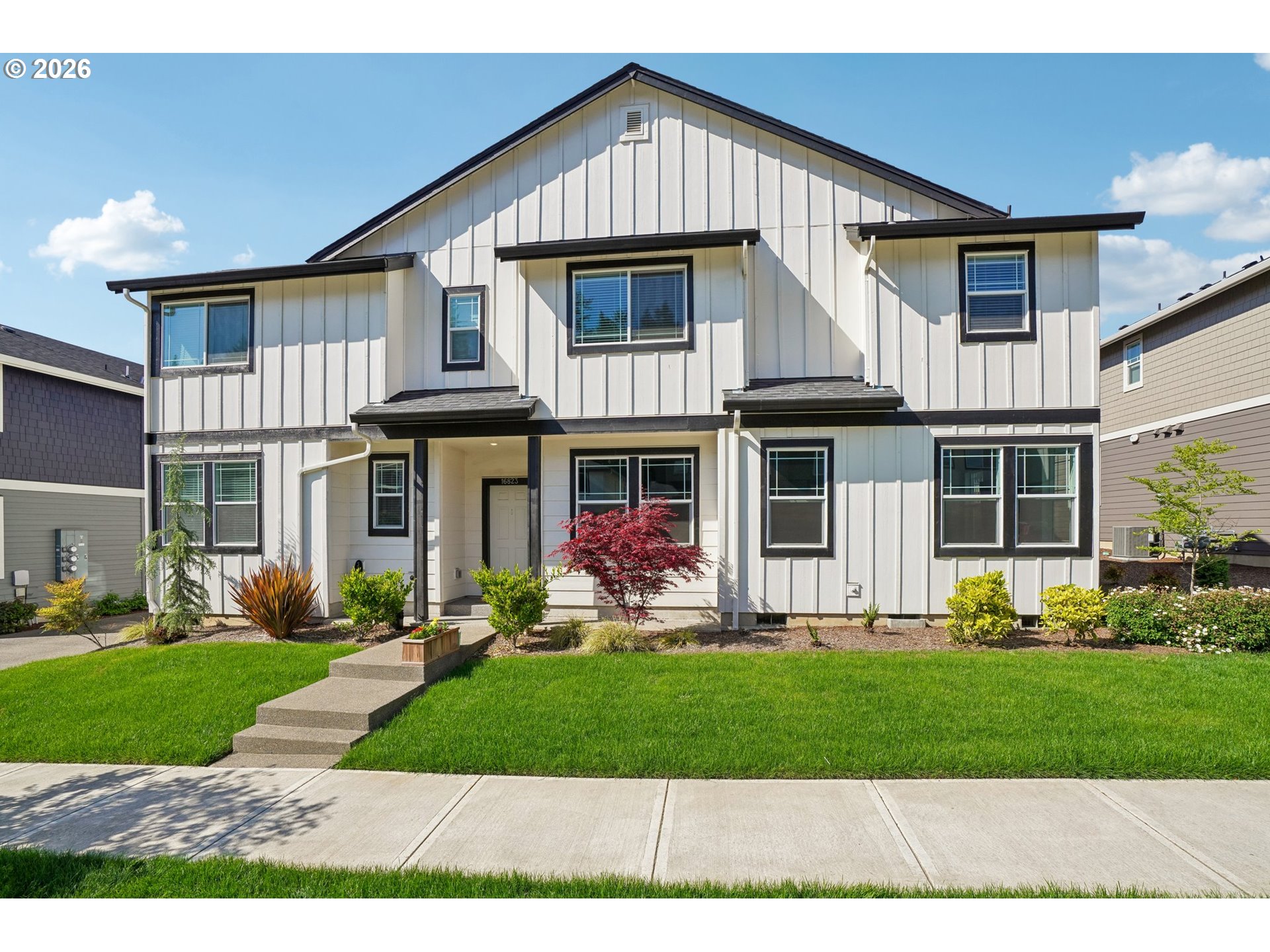 16823 Southwest Colorado Lane Tigard, OR 97224 - Photo 1 of 48 a front view of a house with a yard