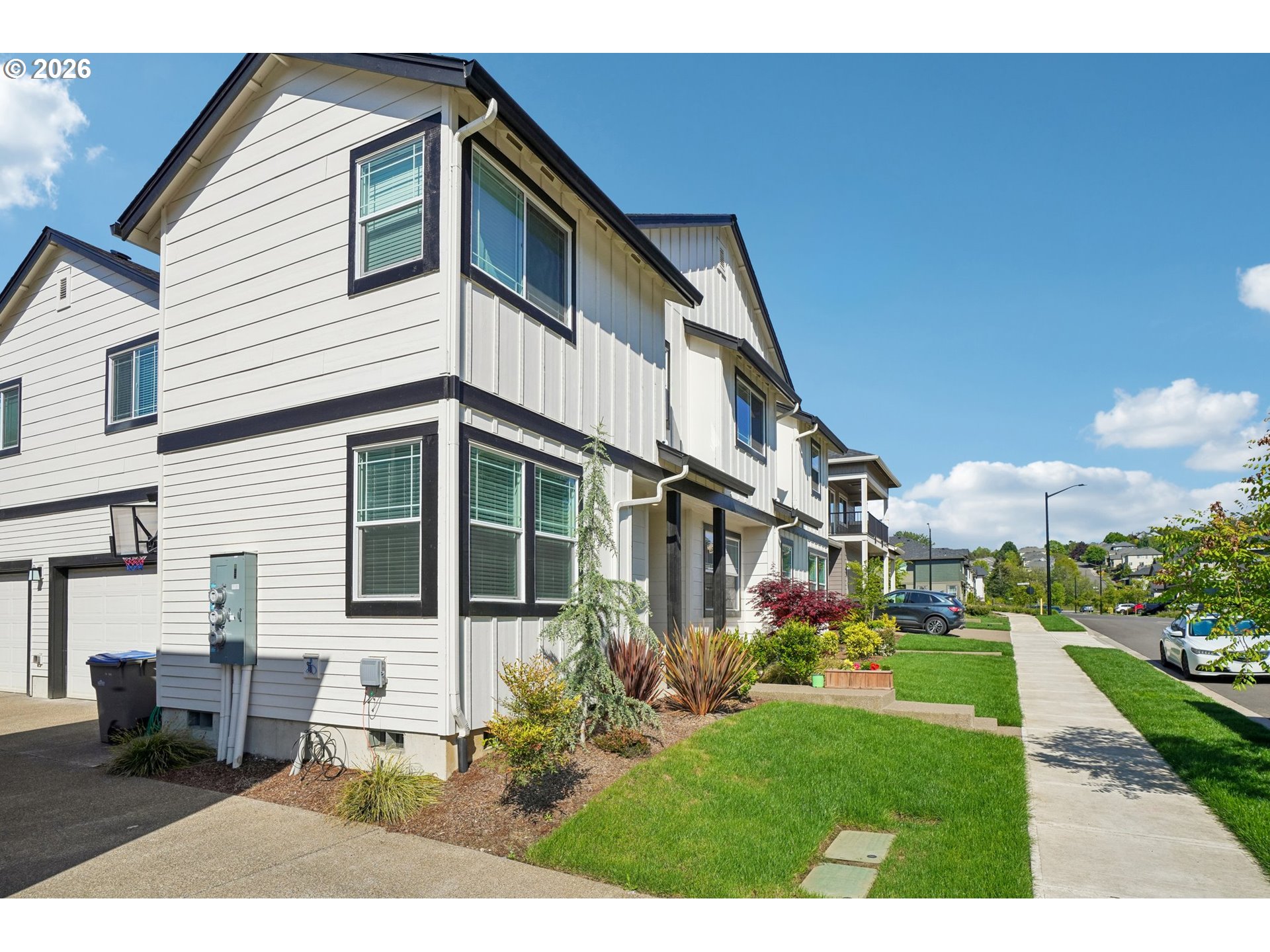 16823 Southwest Colorado Lane Tigard, OR 97224 - Photo 2 of 48 a front view of a house with garden