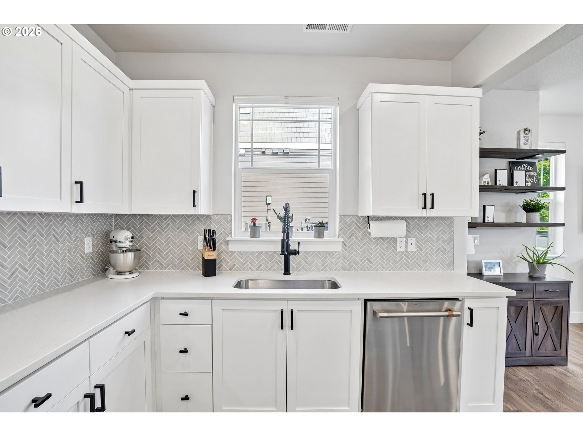 16823 Southwest Colorado Lane Tigard, OR 97224 - Photo 27 of 48 a kitchen with stainless steel appliances granite countertop a sink a stove and cabinets