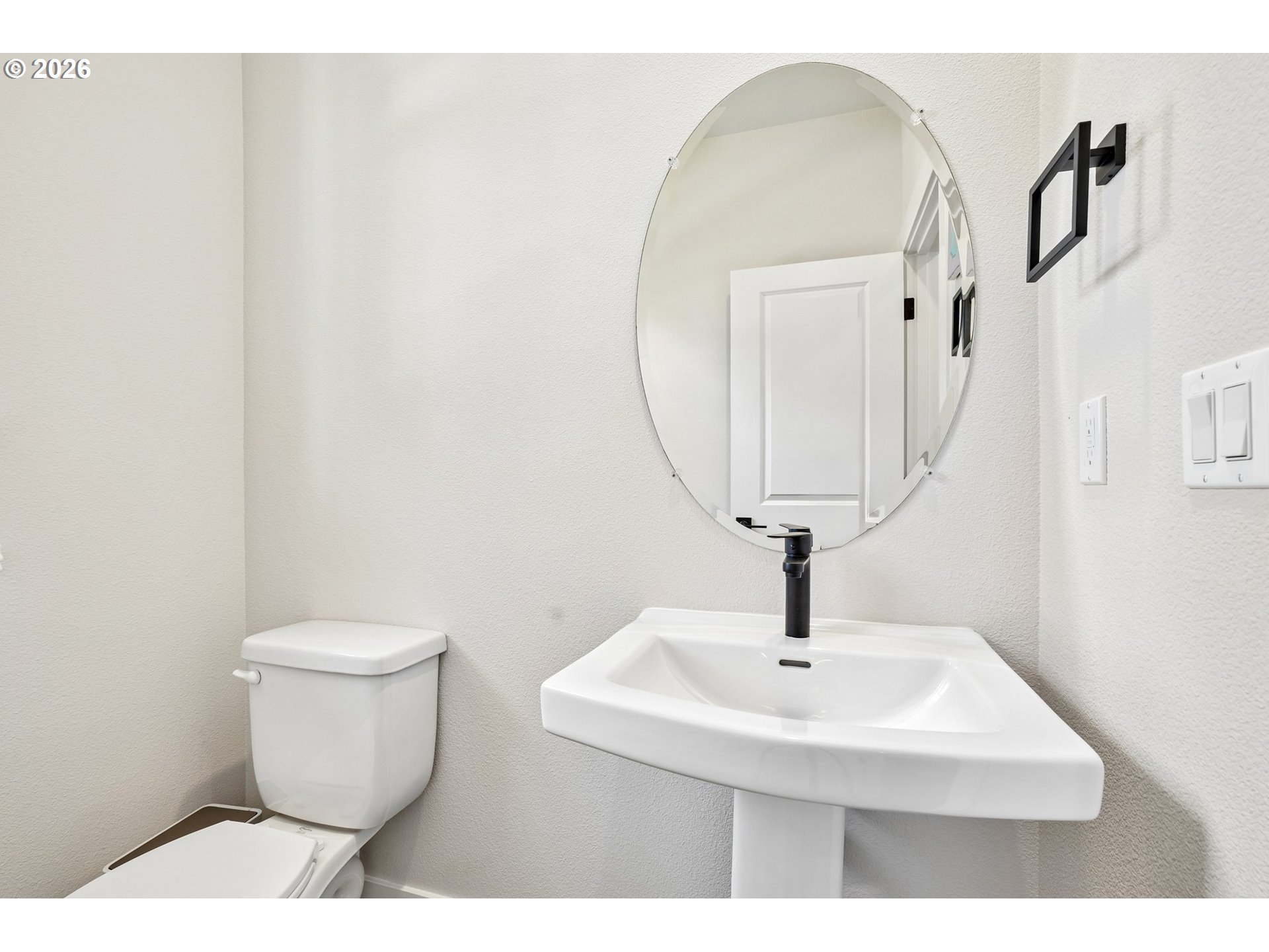 16823 Southwest Colorado Lane Tigard, OR 97224 - Photo 28 of 48 a bathroom with a toilet a sink and mirror