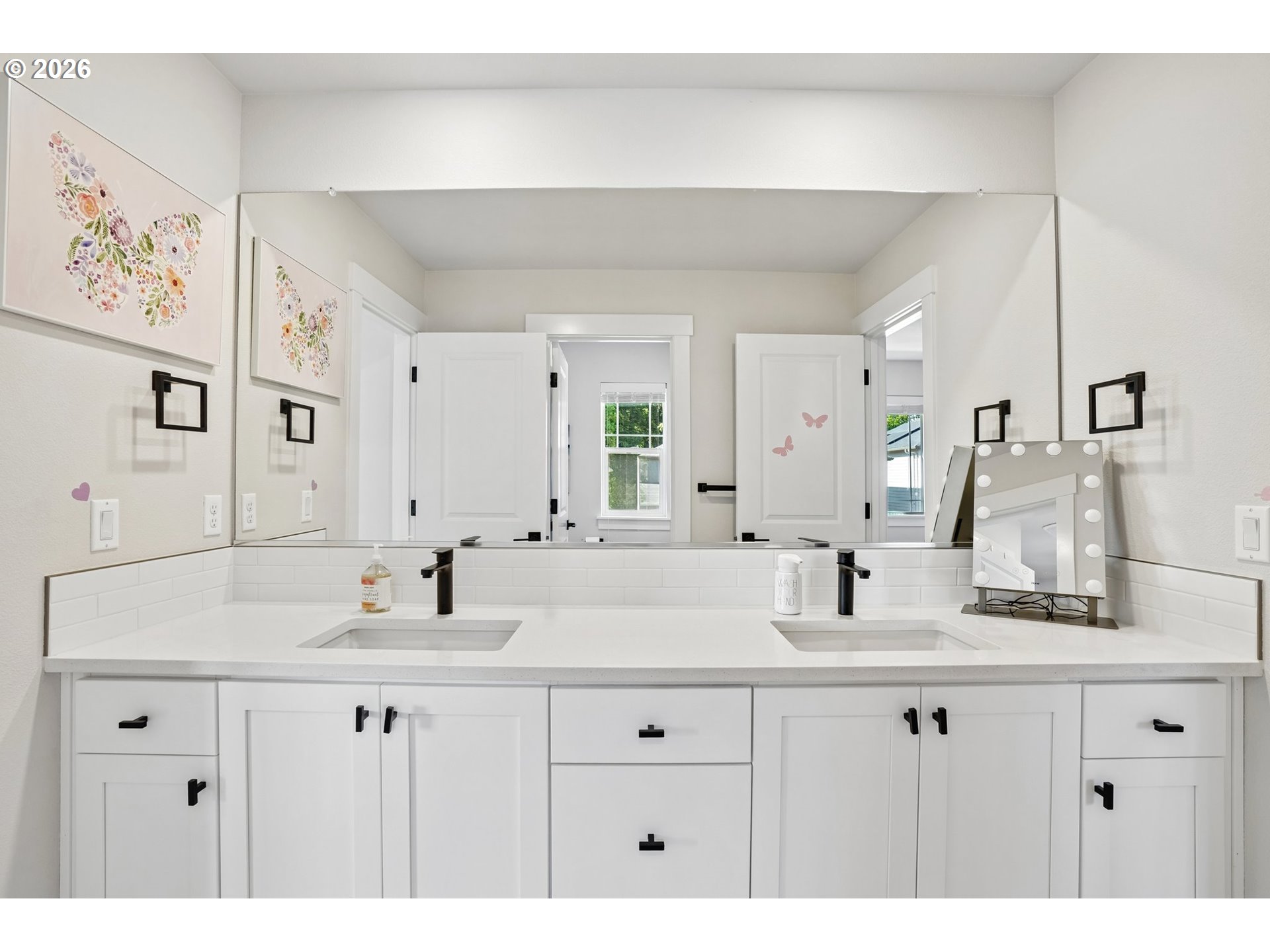 16823 Southwest Colorado Lane Tigard, OR 97224 - Photo 43 of 48 a bathroom with double sink and a mirror