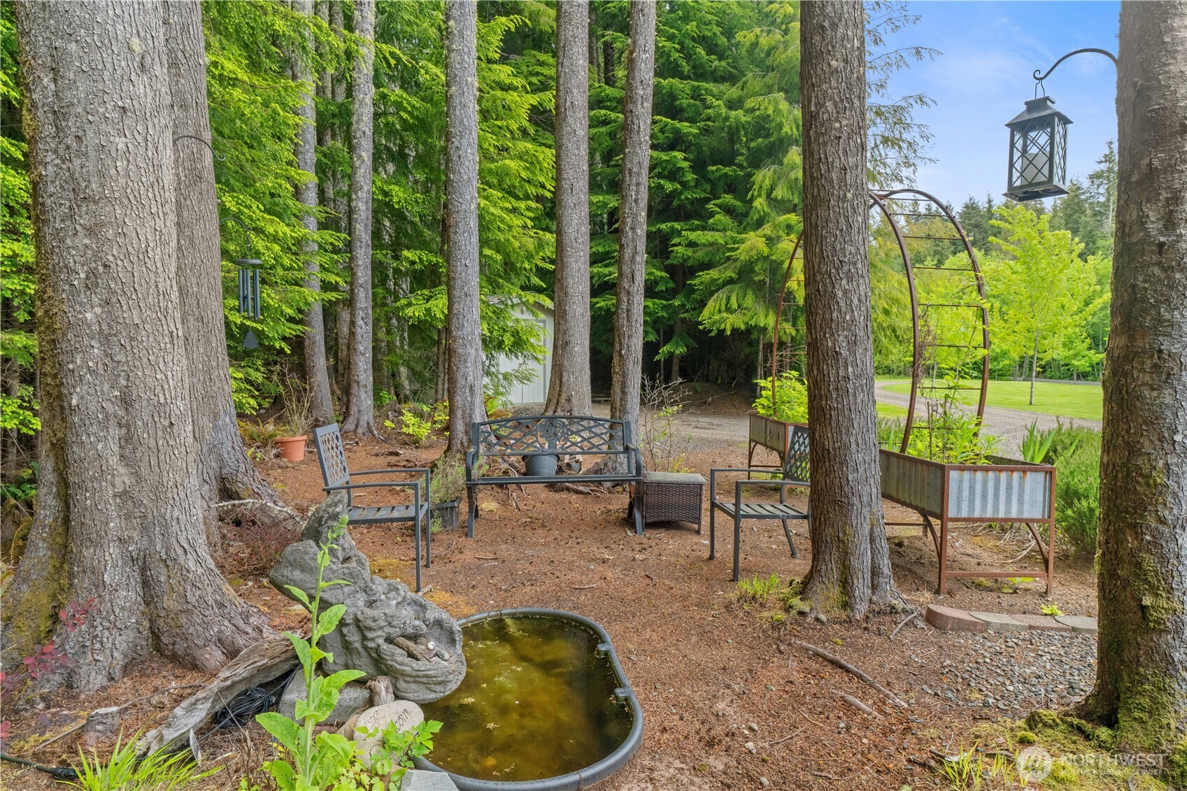 132 River Park Road Forks, WA 98331 - Photo 38 of 40 a view of a swimming pool with chairs in patio