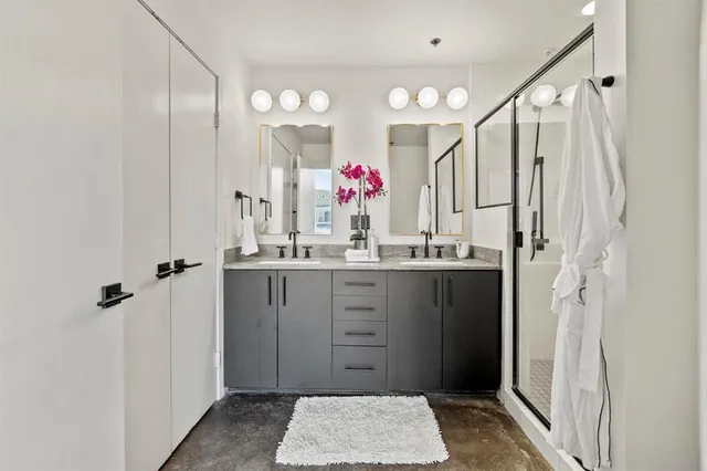 a bathroom with a sink vanity and mirror