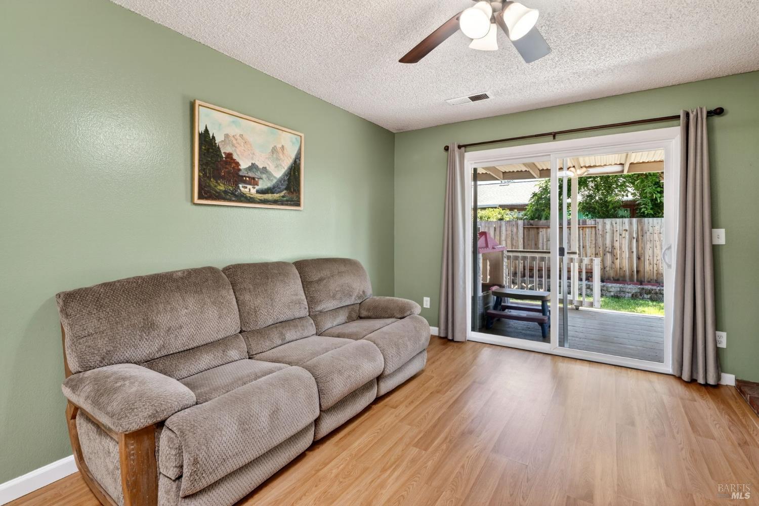 4526 Hillview Court Rohnert Park, CA 94928 - Photo 12 of 28 a living room with furniture and a large window