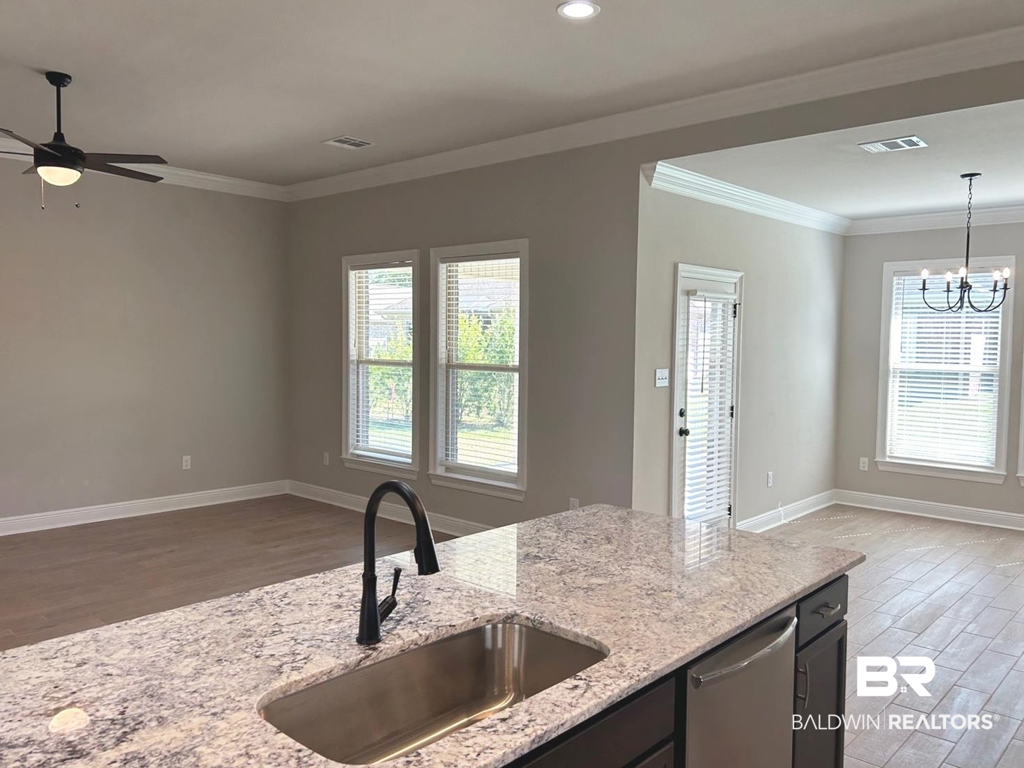 848 Sumter Loop Foley, AL 36535 - Photo 3 of 16 Kitchen with hardwood / wood-style flooring, sink, plenty of natural light, and pendant lighting