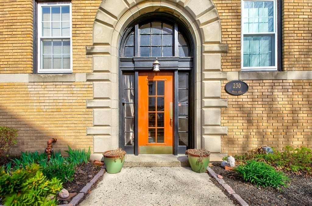 230 Massachusetts Avenue, Unit 2 Arlington, MA 02474 - Photo 2 of 25 a front view of a house with a outdoor space