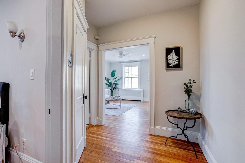 230 Massachusetts Avenue, Unit 2 Arlington, MA 02474 - Photo 4 of 25 a view of a livingroom with furniture and wooden floor