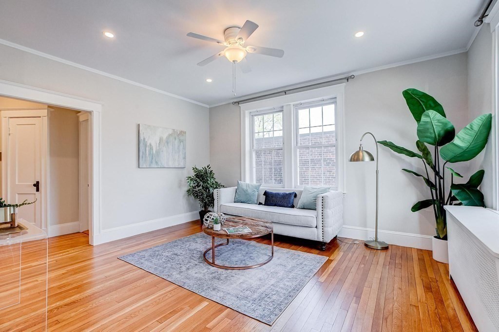 230 Massachusetts Avenue, Unit 2 Arlington, MA 02474 - Photo 6 of 25 a living room with furniture and a wooden floor