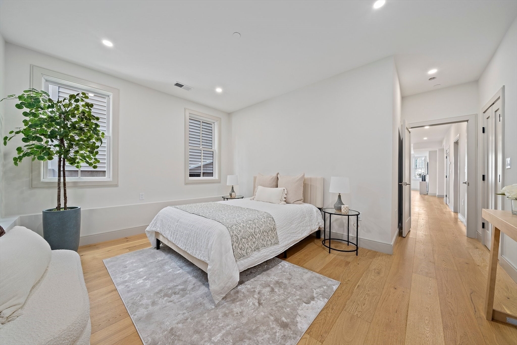 59 Falcon Street, Unit 3 Boston, MA 02128 - Photo 15 of 23 a spacious bedroom with a bed and a couch