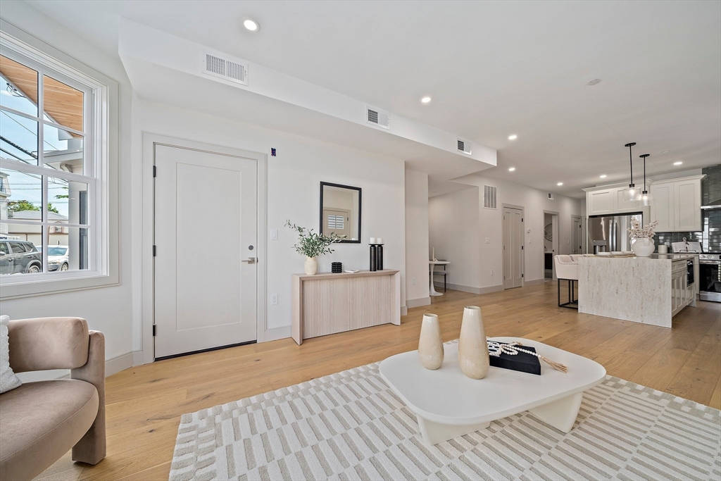 59 Falcon Street, Unit 3 Boston, MA 02128 - Photo 10 of 23 a living room with furniture and a wooden floor